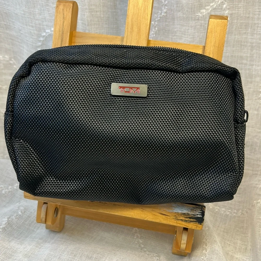 TUMI new never used cosmetic bag with some goodies